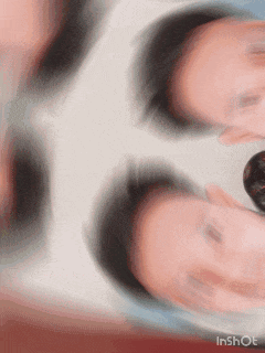 a blurred image of a person 's face with the words inshot visible