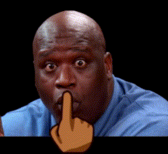 a man in a blue shirt is making a funny face with his finger to his mouth