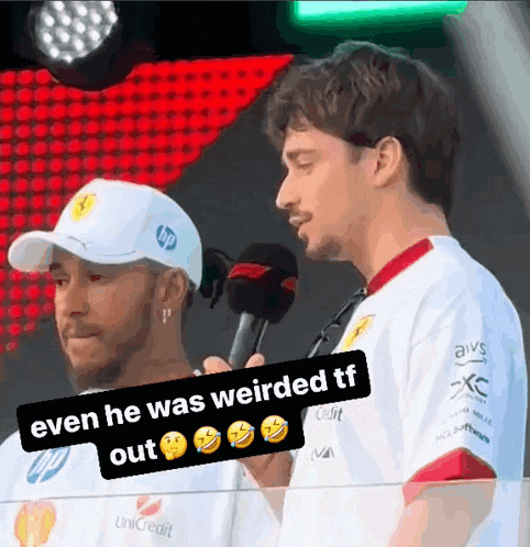 a man holding a microphone with the words even he was weirded tf out