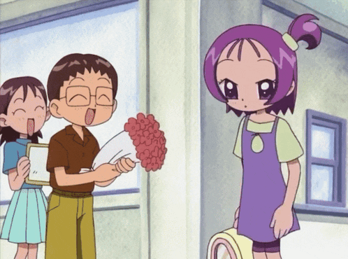 a boy is holding a bouquet of flowers in front of a girl with purple hair
