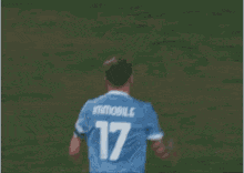 a soccer player with the number 17 on their shirt