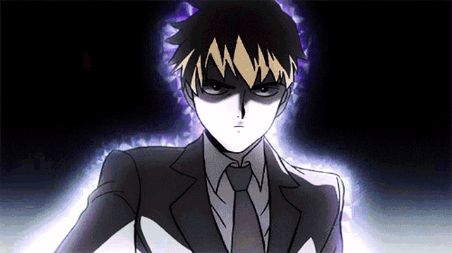 a man in a suit and tie is standing in a dark room
