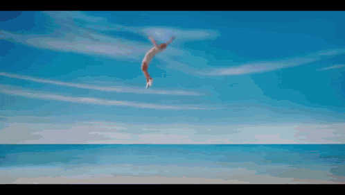 a painting of a person jumping into the ocean with a blue sky in the background