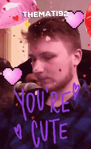 a man with hearts on his face and the words you 're cute