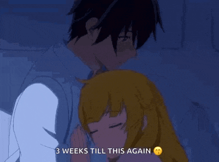 a man and a woman are hugging each other in a dark room .