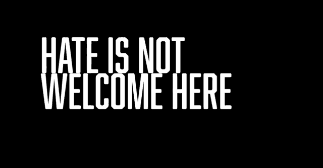 a black background with the words hate is not welcome here