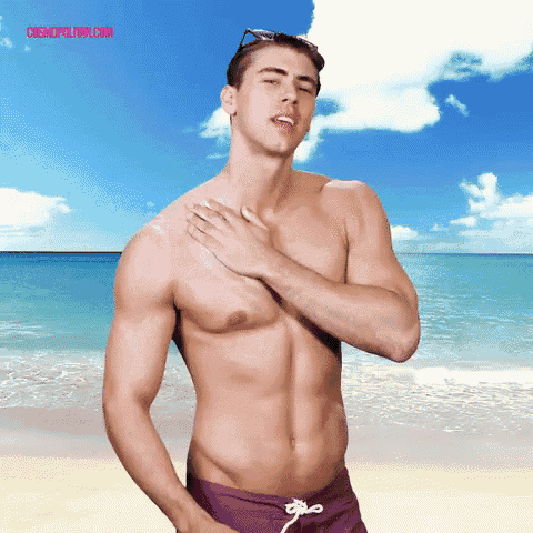 a shirtless man in purple swim trunks on a beach with cosmopolitan.com written on the bottom