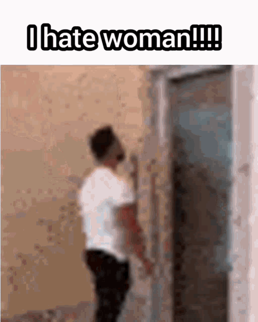 a man is standing in front of a door with the words " i hate woman !!! " on the bottom