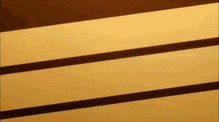 a close up of a wooden shelf with a shadow of a person on it .
