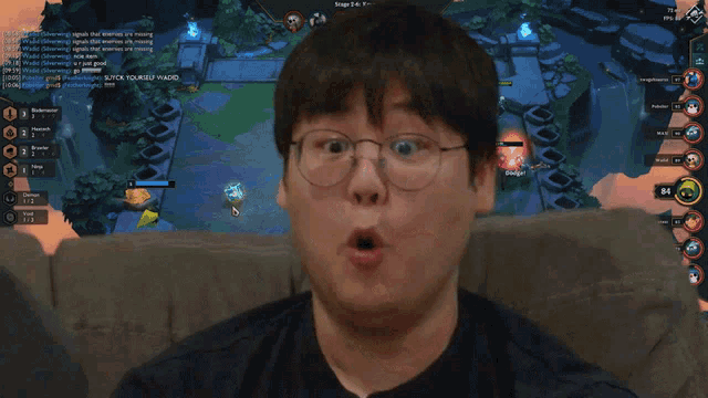 a man wearing glasses looks surprised in front of a video game screen that says step 3-4 krieg