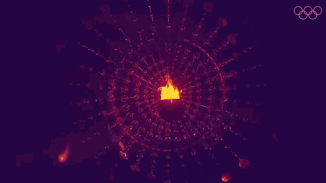 a purple background with the olympic rings and a fireworks display