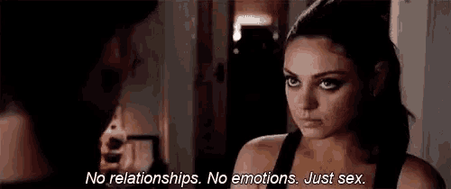 a woman is talking to a man in a dark room and saying `` no relationships , no emotions , just sex . ''