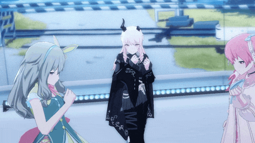 a girl with horns on her head is standing next to another girl
