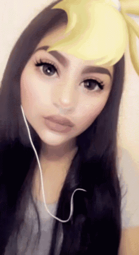 a woman wearing headphones and a yellow flower filter on her face