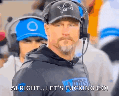 a man wearing headphones and a lion hat says alright let 's fucking go !