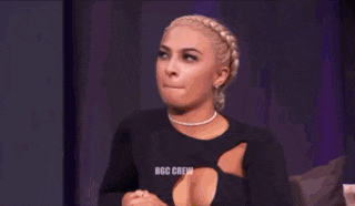a group of women are sitting on a couch and a table with the word boo crew on it