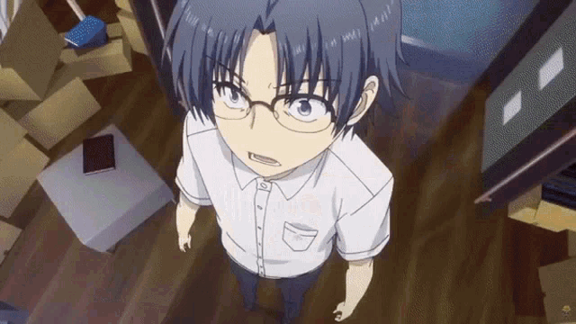 a boy wearing glasses and a white shirt is standing in a room full of boxes .