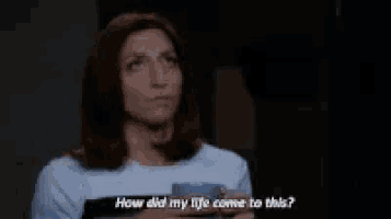 a woman is holding a cup of coffee and asking how did her life come to this .