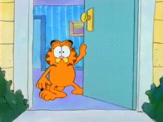 garfield is standing in a doorway waving his hand