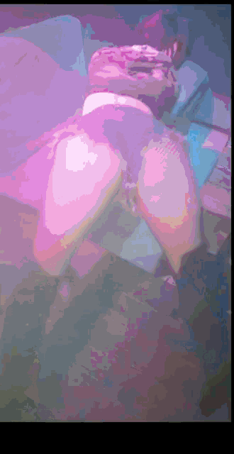 a blurred image of a person 's feet with a purple background