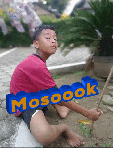 a boy is sitting on the ground with the word mosoook written on it