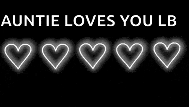 auntie loves you lb is written on a black background with hearts glowing in the dark .