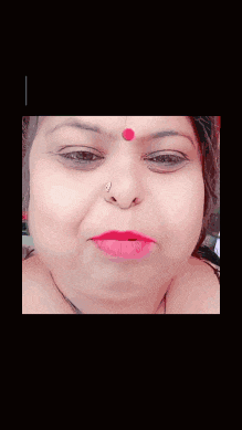 a close up of a woman 's face with pink lipstick and a nose ring