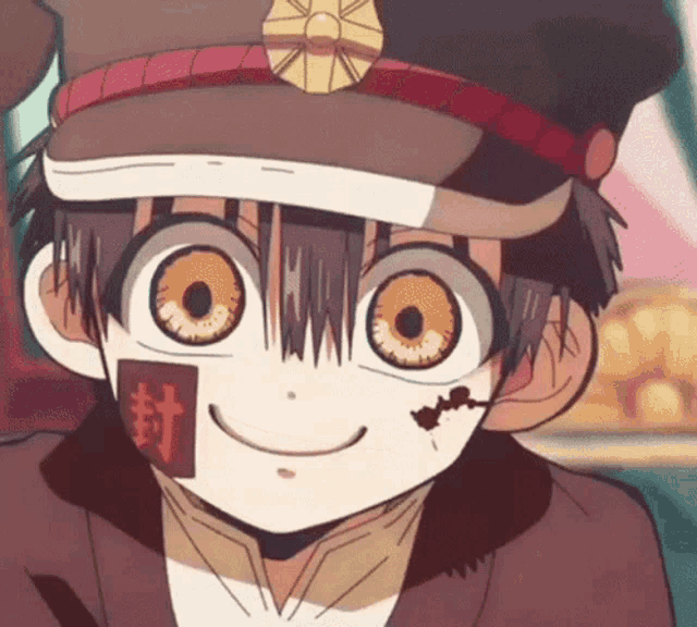 a close up of a cartoon character with big eyes and a hat on .