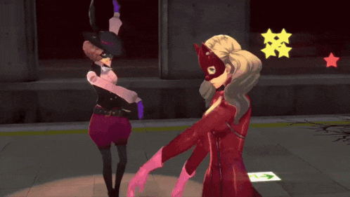 a woman in a red costume is standing next to another woman in a pink glove