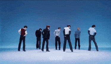 a group of men are standing in front of a blue background with the word choom on it