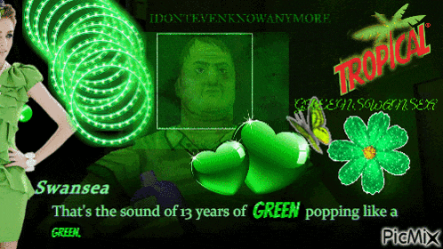 a woman in a green dress stands in front of a picture of a man with the words tropical on the bottom