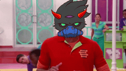 a man in a red shirt has a drawing of a monster on his shirt