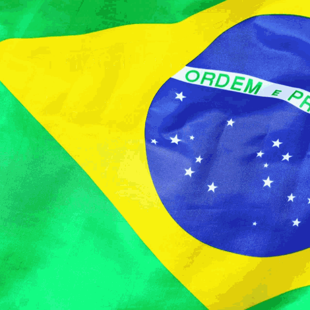 a close up of a brazilian flag with the words ordem e pr