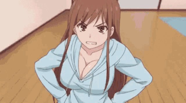 a girl in a blue hoodie is standing in a room with her hands on her hips and looking angry .