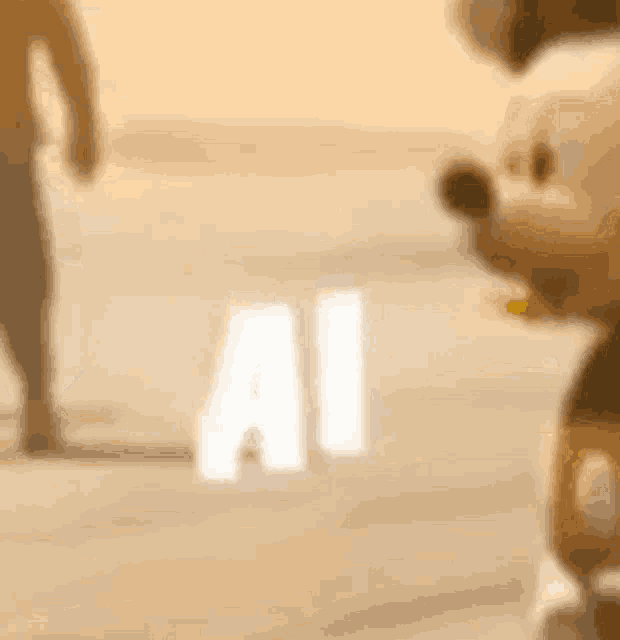 a mickey mouse mascot is standing next to a man walking on a beach .