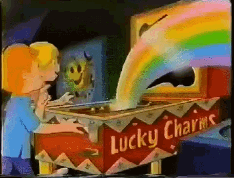 a girl is opening a box of lucky charms with a rainbow coming out of it .