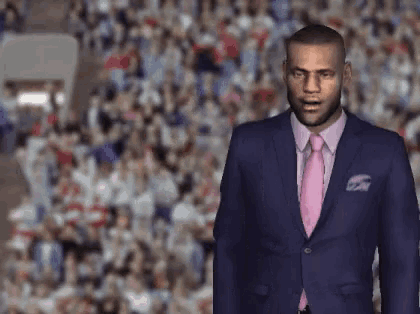 a man in a suit and tie stands in front of a crowd of people
