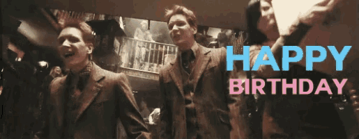 a group of men in suits are standing in front of a sign that says " happy birthday "