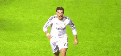 a soccer player in a white jersey is running on a soccer field .