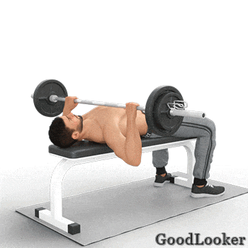 a man is laying on a bench with a barbell on his shoulders