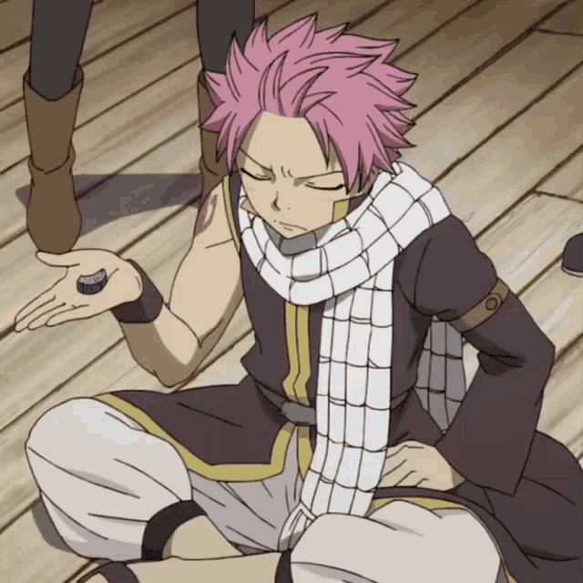 a cartoon character with pink hair is sitting on the floor