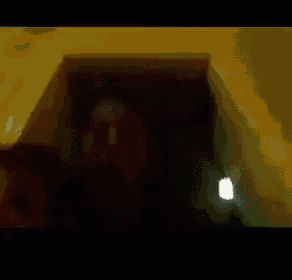 a white circle with a triangle in the middle is playing a video .
