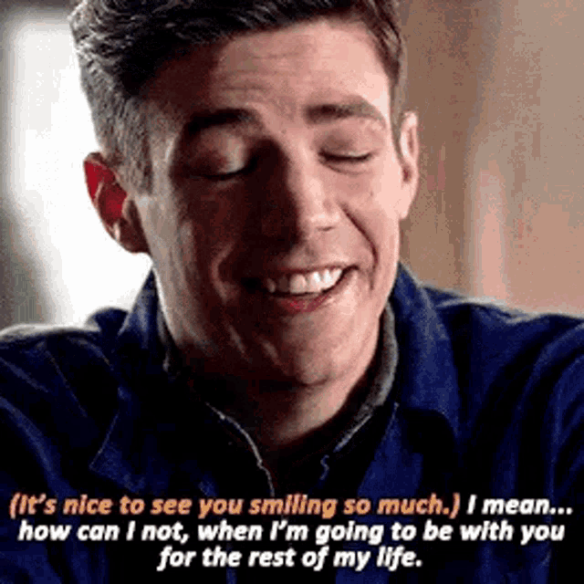 a man is smiling with his eyes closed and a quote on his face .