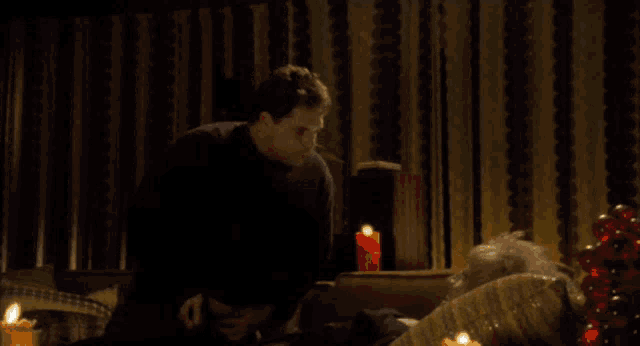 a man is talking to a woman who is laying on a couch and the words do you got any porn are on the screen