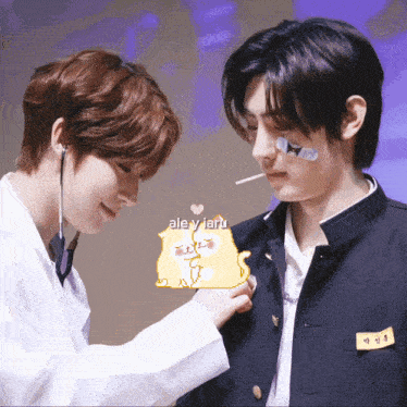 two boys are standing next to each other and one has a name tag that says " ale y jaru "