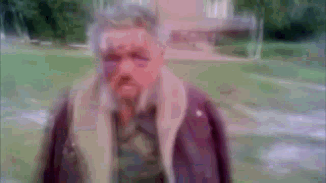 a blurry picture of a man with a beard