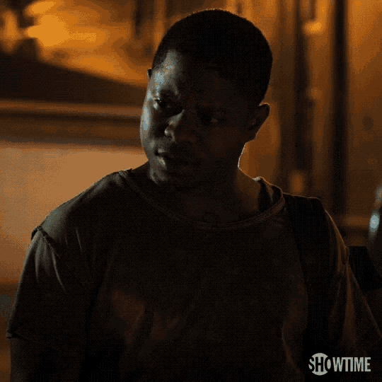 a man in a dark room with showtime written on the bottom right