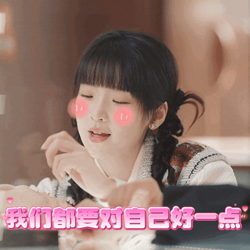 a girl with pigtails has a pink cheek sticker on her face