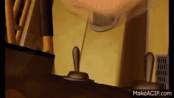a close up of a cartoon character 's face with a toggle switch in the background .