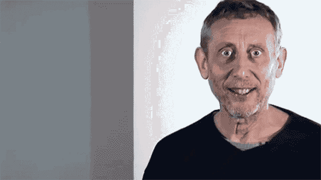 a man with a beard and a black shirt is making a funny face